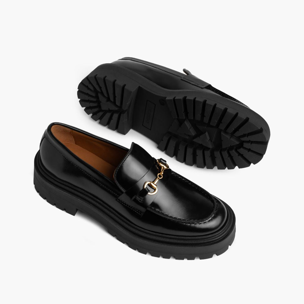 High-Traction Rubber Outsole & Lug Tread Pattern on Penny Platform Black & Gold Leather Loafers