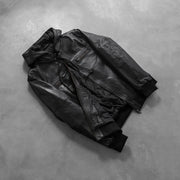 
Styled Fit Perspective of Bouncer Biz Black Leather Hooded Bomber Jacket on Model - Natural Daylight Drape