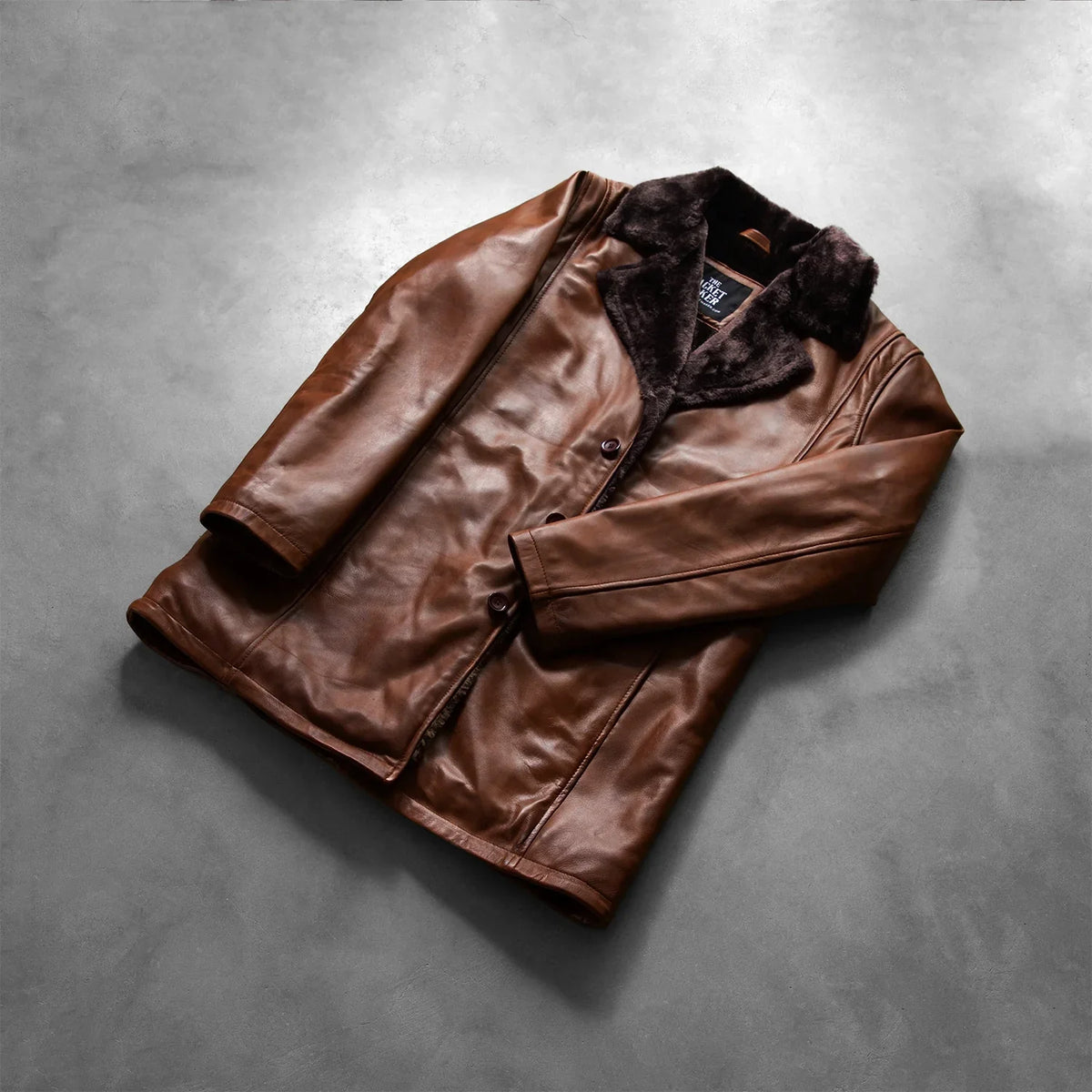 
Open Hem & Hem Craftsmanship Construction Detail on Cinnamon Distressed Leather Fur Coat