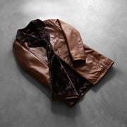 
Styled Fit Perspective of Cinnamon Distressed Leather Fur Coat on Model - Natural Daylight Drape