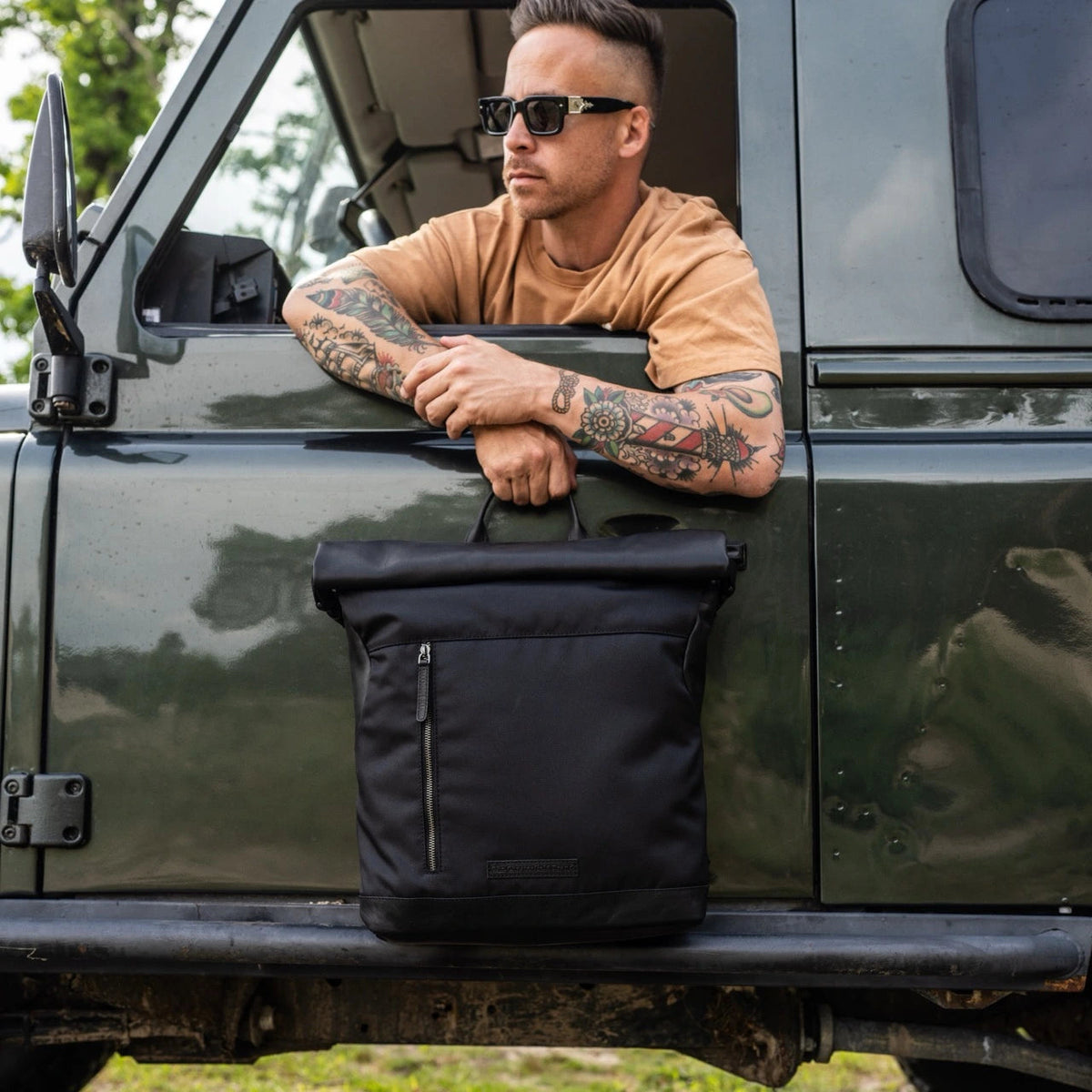 
Bornholm Full-Grain Leather Roll-top Backpack - Structured Side Profile Showing Gusset Depth & Expansion Capacity