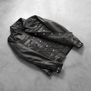 Button &amp; Hem Craftsmanship Construction Detail on Men's Ranchson Svart Leather Shirt for Herre